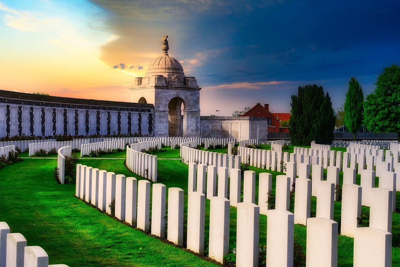 A row of tombstones with an old church behind